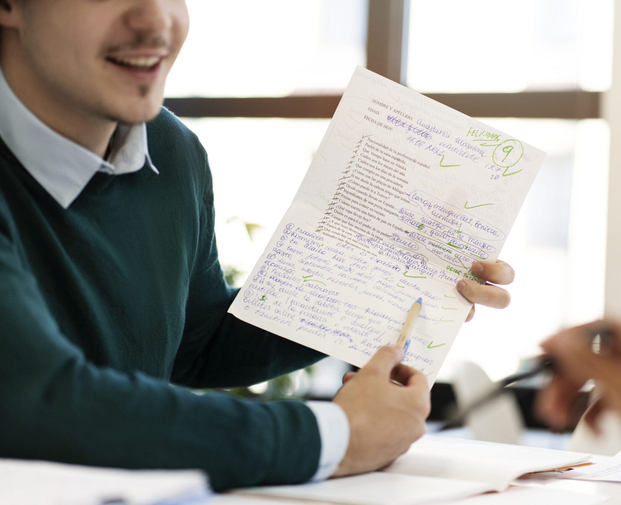 side view smiley man holding paper